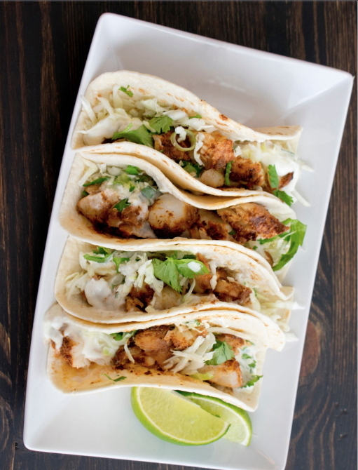 Blackened fish tacos with slaw, cilantro, and lime